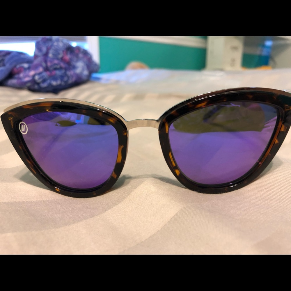 Cat eye glasses with purple lenses